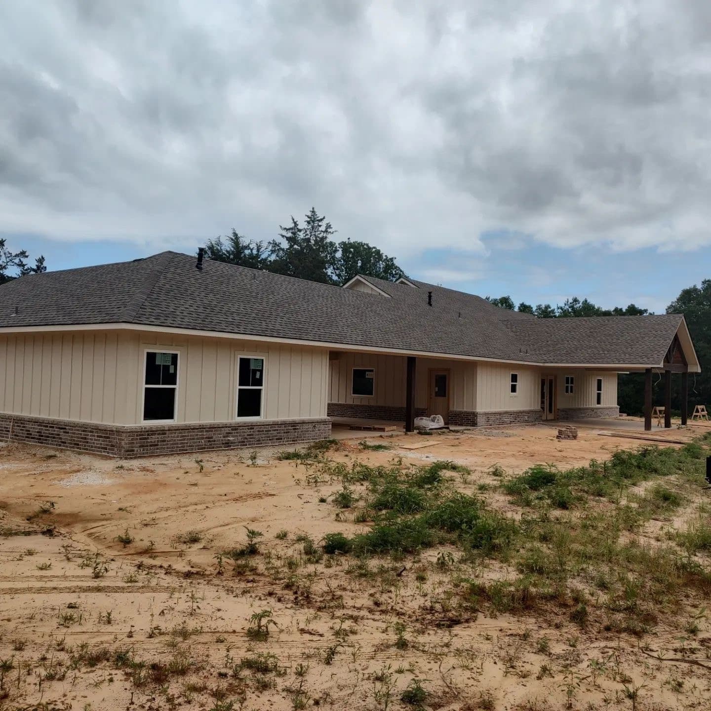 Large gray architectural-shingle roof with hips and valleys