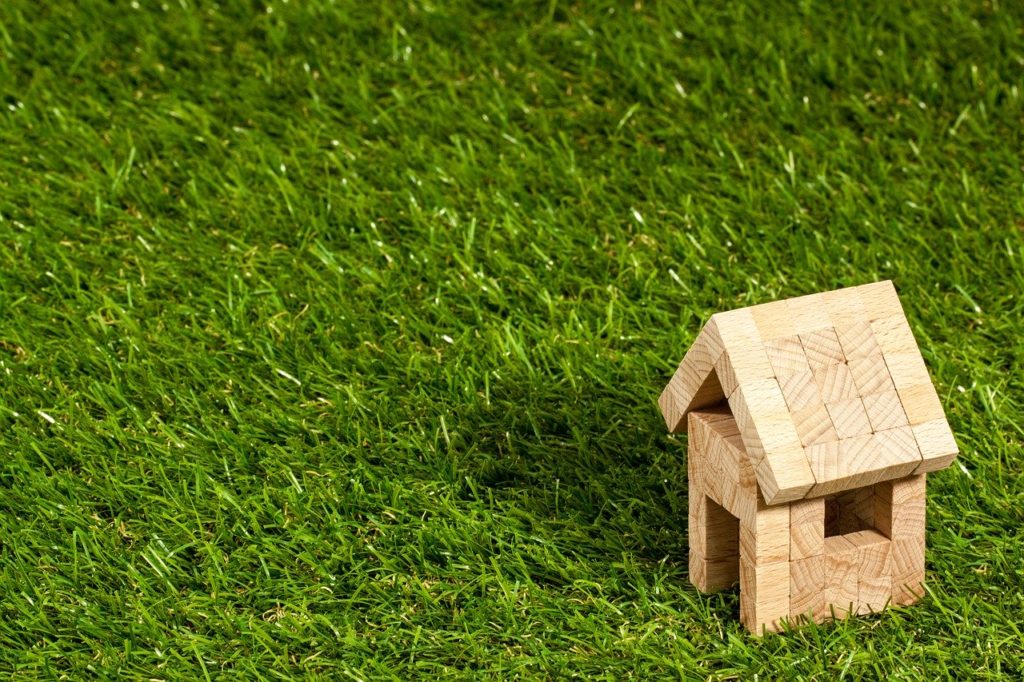 a small wooden house with a roof protecting the house